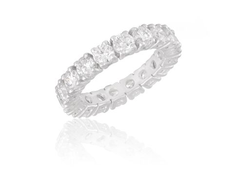 A DIAMOND ETERNITY RINGThe continuous row of brilliant-cut diamonds within claw-setting, mounted in 18K gold, diamonds approx