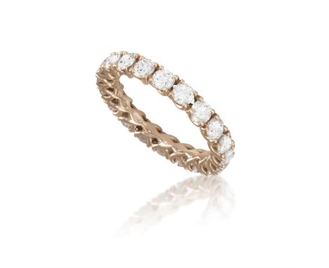 A DIAMOND ETERNITY RINGThe continuous row of brilliant-cut diamonds, each within a four-claw setting, mounted in 18K rose gol