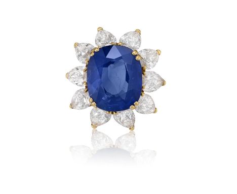 A SAPPHIRE AND DIAMOND CLUSTER RING | VAN CLEEF & ARPELS | CIRCA 1985The cushion-shaped sapphire weighing approximately 8.50c