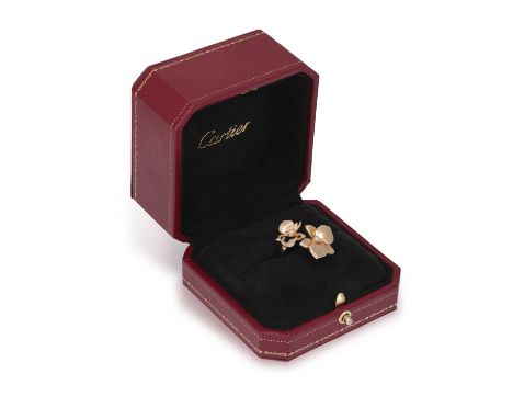 A DIAMOND 'CARESSE D'ORCHIDÉES' RING, BY CARTIER, 2009Composed of two orchid flowerheads, each with polished gold petals cent