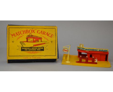 A boxed Matchbox MG1a 'Showroom and Service Station' with red plastic building, yellow base and roof sign together with a die