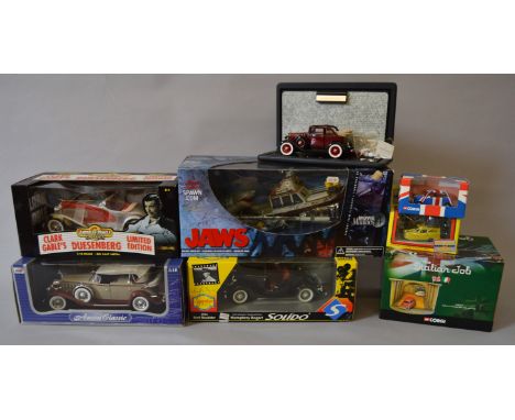 A mixed group of boxed diecast models in various different scales by Corgi, Solido and others together with a boxed 'Jaws' di