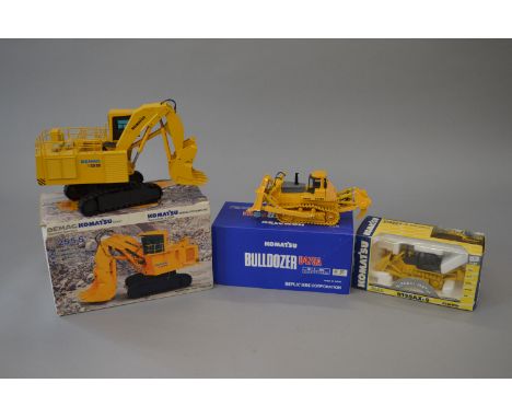 Three Komatsu 1:50 scale diecast models: Joal 277 Bulldozer D155AX-5; NZG 442 Hydraulic Mining Shovel H 255 S; Replicars Bull