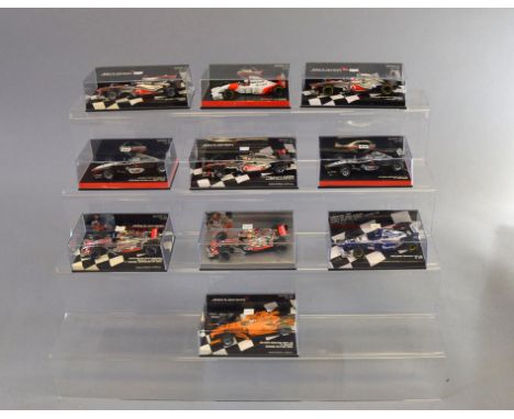 Ten boxed Minichamps diecast F1 Racing Car models in 1:43 scale, including Vodafone McLaren Mercedes MP4-27 J. Button 2012 an