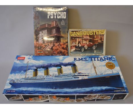 Three boxed plastic assembly kits, an Academy R.M.S. Titanic kit in 1:400 scale, the outer box of which has been opened howev