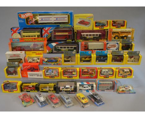 A quantity of boxed diecast models by Corgi, Solido, Bburago and others including a Solido London RT Bus  together with an op