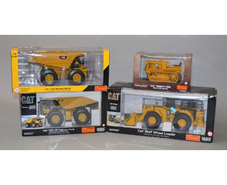 Four Norscot Cat diecast models: Twenty-two Track-type Tractor 1:16 scale; 793D Off Highway Truck 1:50 scale; 994F Wheel Load