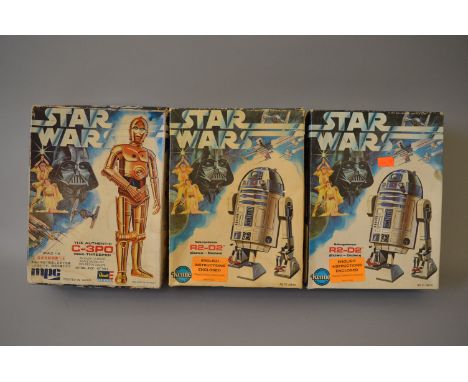 Three vintage Star Wars plastic model kits: MPC (Revell/Takara) C-3PO 1:18 scale, pieces still sealed in plastic bag, include