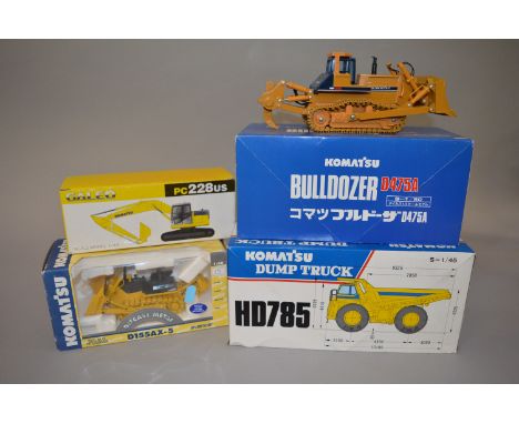 Four boxed diecast 'Komatsu' Construction Vehicle models in scales ranging from 1:43 to 1:50 scale by Replicars and others in