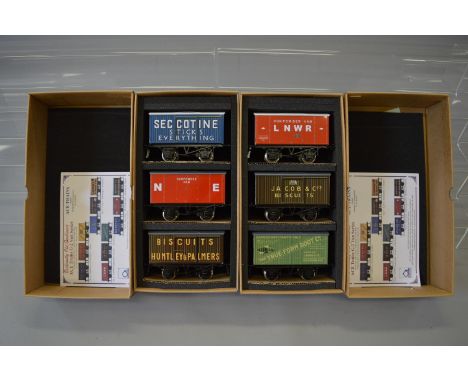 O gauge. Two ACE Trains Private Owners Van Sets: Set 8 containing LNWR Gunpowder Van, Jacob & Co. Biscuits & True Form Boot C