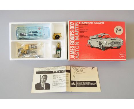 James Bond 007. Strombecker Raceways James Bond's Aston Marton 1:32 scale motorised slot car. Contents are VG, not checked fo