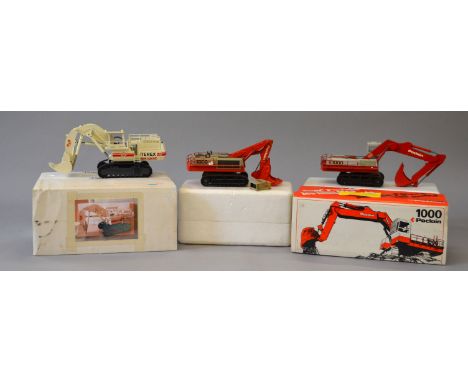 Three 1:50 scale diecast model construction vehicles: two Sijam Poclain 1000 (one missing outer sleeve of box); Conrad 2771/0