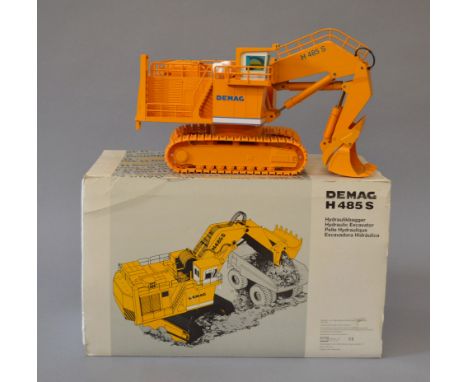NZG 357 Demag H 485 S Hydraulic Excavator, yellow, 1:50 scale diecast model. G+, some paint wear, boxed.