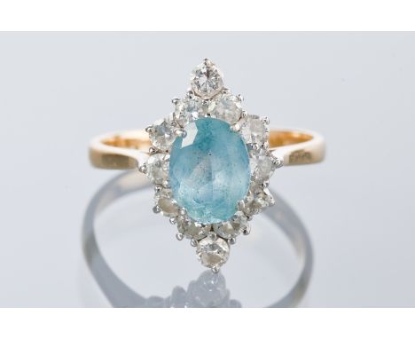 EIGHTEEN CARAT GOLD AQUAMARINE AND DIAMOND CLUSTER RING
the central oval aquamarine within a marquise shaped bezel set with r