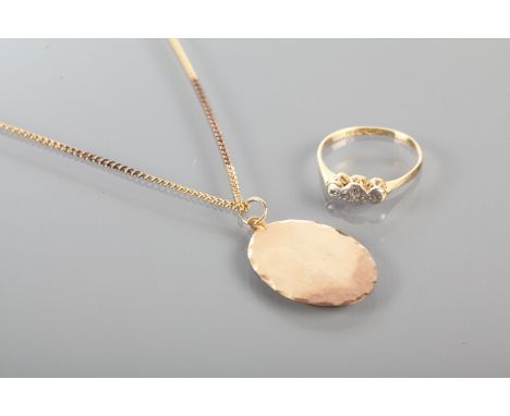 NINE CARAT GOLD PENDANT ON CHAIN
the pendant of oval form; along with an illusion set diamond three stone ring (2)