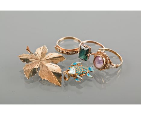 FOLIATE MOTIF BROOCH
marked 375 for nine carat gold; along with a nine carat white gold gem set ring; a nine carat gold ameth