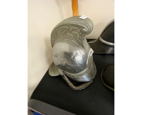 EARLY 20 CENTURY MANCHESTER FIRE BRIGADE CHIEF FIRE OFFICERS HELMET TOGETHER WITH A PHOTOGRAPH OF OFFICER &amp; HELMET