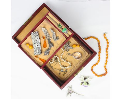 A selection of jewellery, including Chinese green hardstone ring, set in white metal, amber coloured beaded necklace, Art Dec