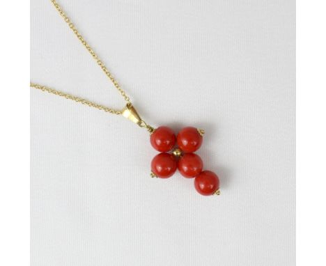 A yellow metal chain, the trace link chain with bolt ring fastener stamped ‘750’ suspending  cross pendant, comprising five s