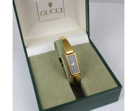 A ladies Gucci wristwatch, the black rectangular dial set to gold coloured plain polished case, stamped '1500' to reverse, 3c