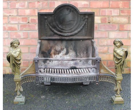 An Adam style cast iron and brass fire grate, late 19th/early 20th century, the break arch fire back cast in relief with a sw