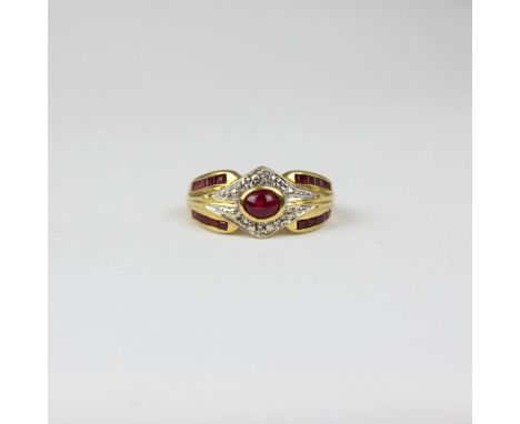 A yellow metal ruby dress ring, the central cabochon within stylised surround of round cut diamond, with two rows of calibre 