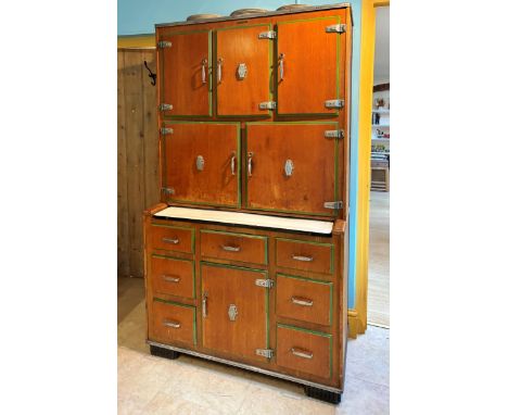 A Vintage Kitchendom unit, Pat No.22279, mid 20th century, formed with an arrangement of five cupboard doors over a sliding e