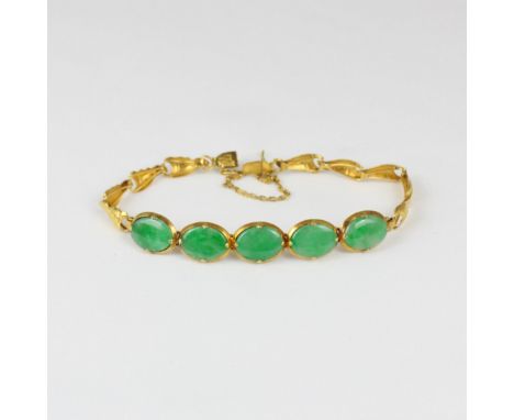 A Chinese yellow metal 'jade' bracelet, composed of five panels, closed to the reverse, upon stylised links, with box and ton