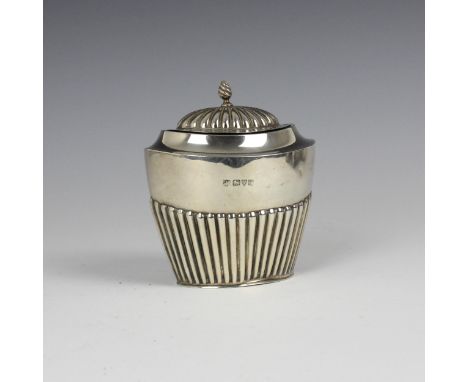 A George V silver tea caddy, Barker Brothers, Chester 1915, the domed hinged cover above gilt interior and demi fluted tapere
