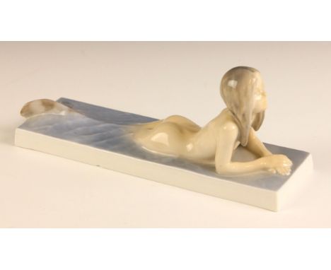 A Royal Copenhagen porcelain figure of a mermaid, model number 1212, printed and painted maker's mark to underside, 19.5cm lo