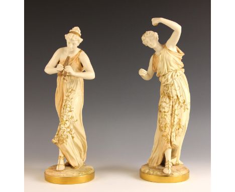 A Royal Worcester gilt ivory figure by James Hadley, early 20th century, modelled as a classical maiden playing the pipes, mo