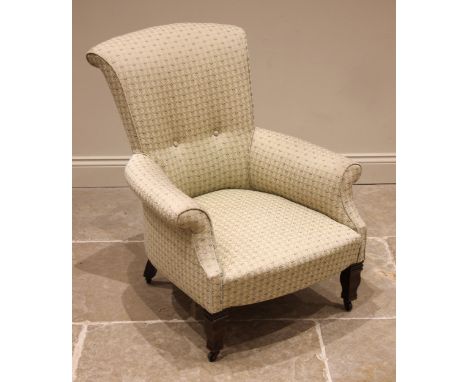 An Edwardian button back armchair, later re-covered in cordiform lattice fabric, the bow front sprung seat upon vase shaped f