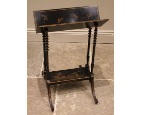 A Japanned freestanding book trough, early 20th century, the 'V' shaped trough upon four turned supports embellished with gil