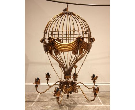 A 20th century gilt metal hanging ceiling light, modelled as a hot air balloon, over six scrolled 'S' shaped arms, 129cm high