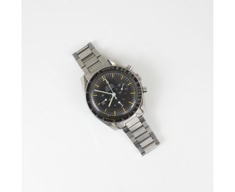 An Omega stainless steel Speedmaster professional wristwatch, the black dial with luminous hands and baton markers, triple su