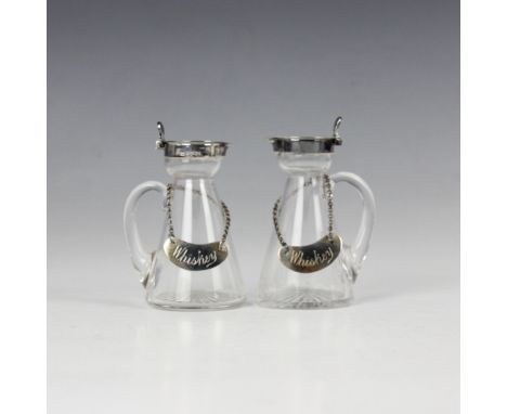 A pair of Edwardian silver mounted whiskey tots/noggins, Lee and Wigfull, Sheffield 1904, the hinged cover above plain polish