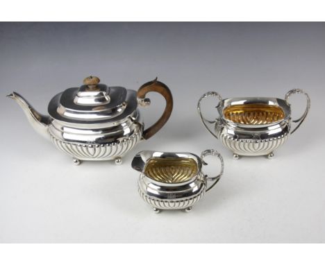 A Victorian near matched three piece silver tea service, Edward Barnard &amp; Sons Ltd, London 1894-1896, comprising tea pot,