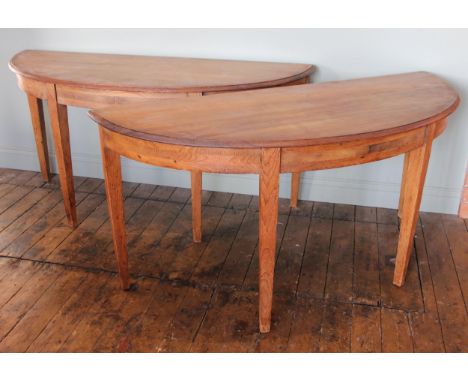 A pair of 19th century stripped pine 'D' end tables, the moulded tops upon legs of tapering square section, each table measur