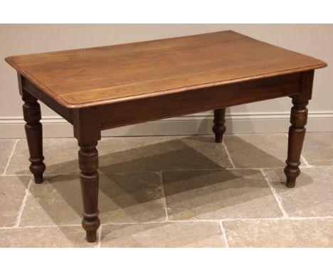 A 19th century oak kitchen/scullery table, the moulded plank top upon turned legs extending to peg shaped feet, 73cm H x 147c