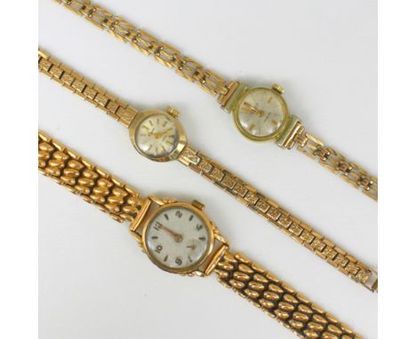 An early 20th century yellow metal ladies wristwatch, the circular dial with baton and Arabic numerals, upon hollow stylised 