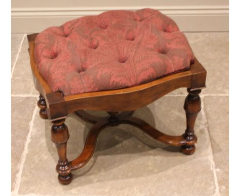 A 17th century style walnut foot stool, late 20th century, possibly by Maitland Smith, the serpentine button down seat, upon 