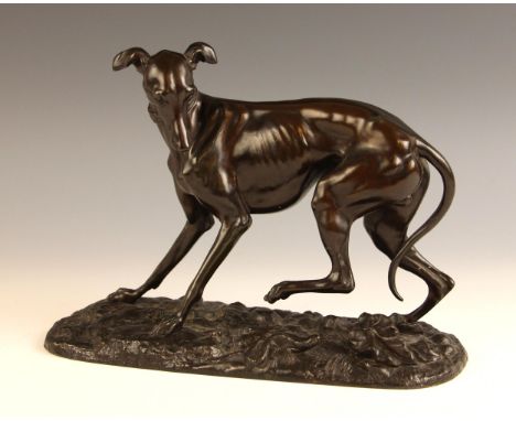 Manner of Pierre-Jules Mene (French, 1810-1879), a patinated spelter model of a whippet or greyhound spooked by a lizard, on 