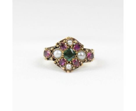 An early 20th century 18ct gold ruby, emerald and 'pearl' ring, the central emerald surrounded by ruby and 'pearl' cluster de