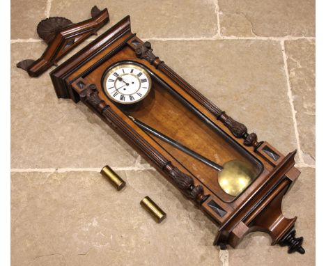 A Victorian walnut cased eight day Vienna wall clock, the architectural case enclosing the 19cm cream dial with subsidiary se