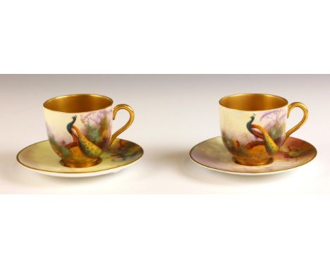 Two Royal Worcester porcelain miniature cabinet cups, early 20th century, each painted with a peacock in a landscape by Alber