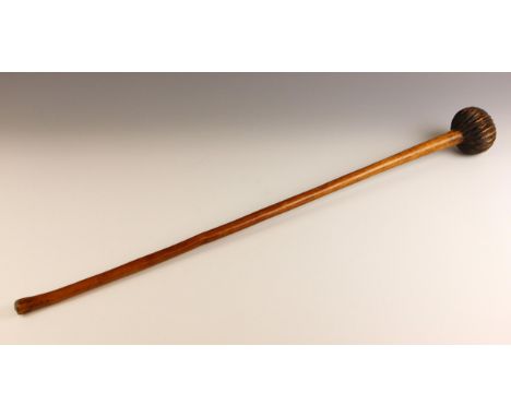 A Zulu knobkerry [knobkerrie] fighting stick or club, late 19th or early 20th century,  the tapering hardwood stick with carv