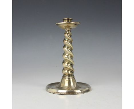 A George V silver candlestick, A &amp; J Zimmerman Ltd, Birmingham 1923, of Arts and Crafts barley twist form, leading to spr