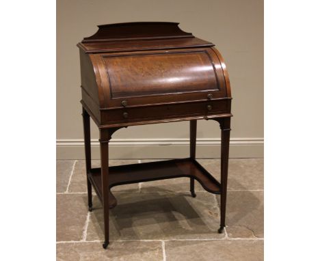 An Edwardian mahogany and satinwood banded cylinder bureau, with a rear gallery above the foliate inlaid cylinder top, openin