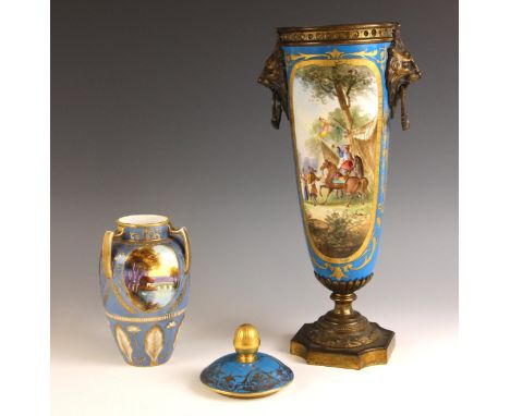 A gilt brass mounted vase in the manner of Sevres, 19th century, the body painted with gilt bordered encampment scenes, the l