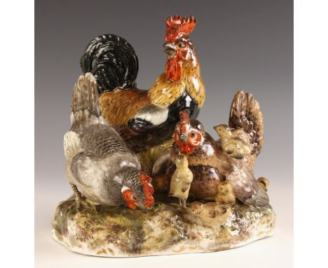 A Meissen porcelain chicken group, 20th century, model number G163, designed by August Ringler circa 1866, unglazed blue cros